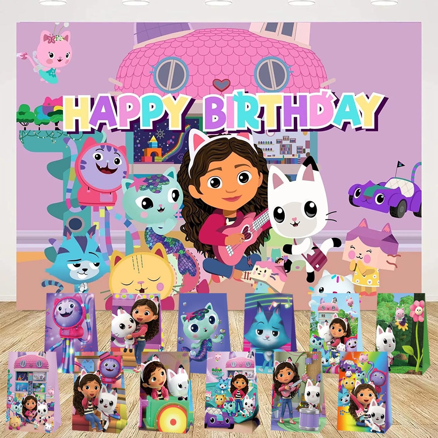 Birthday party decorations with cartoon characters and 'Happy Birthday' text on a purple background.
